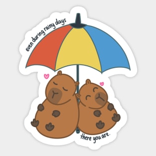 Capybara Couple in Love Under Rainbow Umbrella During Rainy Days Sticker